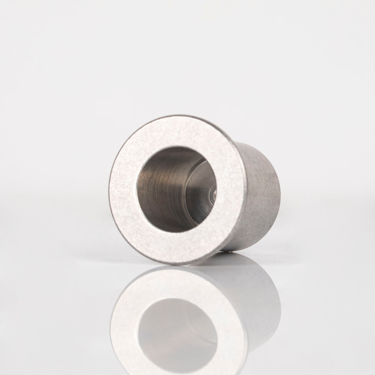 Simrell 18mm to 25mm coil adapter on its side, showing the opening for the Hydro XL chamber