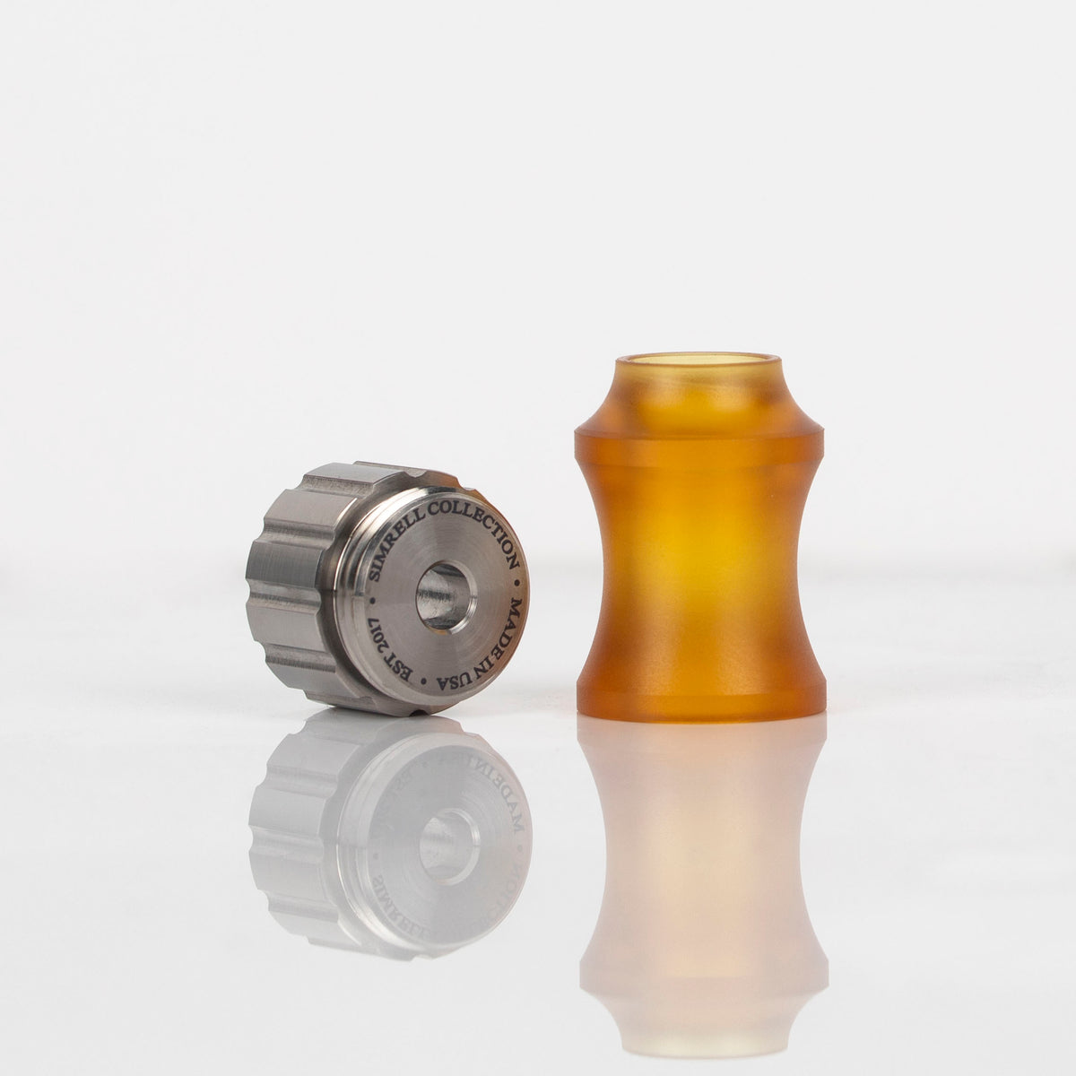 Simrell titanium XL Stem Adapter beside its Ultem sleeve